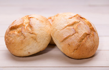 Tasty buns on wooden background