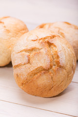 Tasty buns on wooden background