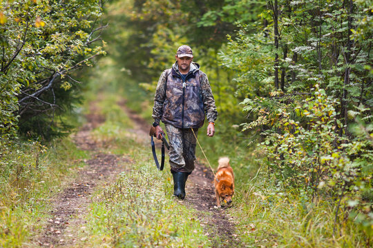 hunter with dog waiting for prey