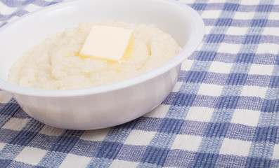 White Bowl of White Grits wtih Butter Close