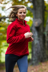 Healthy lifestyle - woman running in park