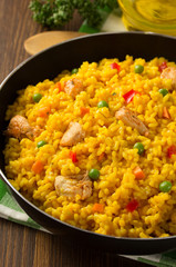 frying pan full of rice on wood