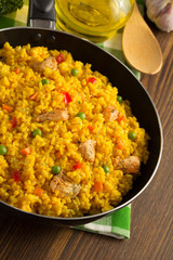 frying pan full of rice on wood