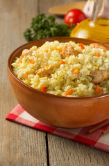 bowl full of rice on wood