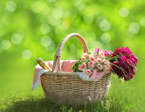 Romance, love and valentine's day concept - basket and flowers