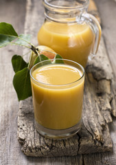 glass and pitcher with pear juice