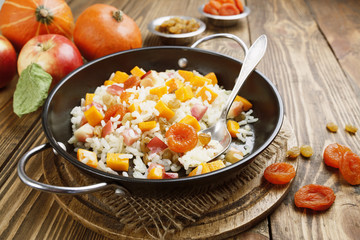 Sweet pilaf with pumpkin, apples and dried fruit