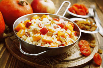 Sweet pilaf with pumpkin, apples and dried fruit