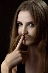 Naklejka premium woman shows mustache