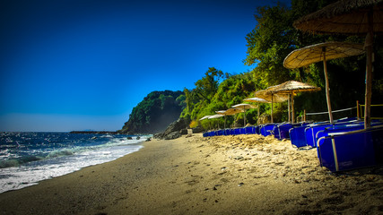 Plaka beach, Pelion, Greece. Sandy beach with rocks.