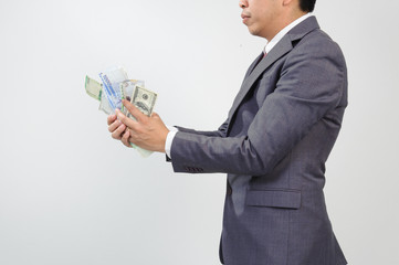 Man in suit holding knife and korean won