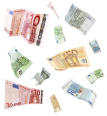 Obraz na płótnie Canvas Flying Euro banknotes isolated on white