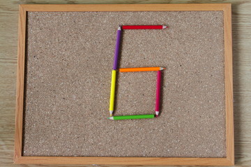 Board and numbered and colored pencils