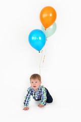 Fototapeta na wymiar Boy with colorful balloons