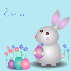 Small Easter bunny with egg in his paws