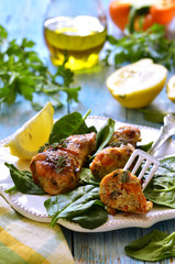 Roasted chicken legs stuffed with carrot and mushrooms.