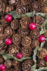 Macro shot of a Christmas decoration featuring small pines.