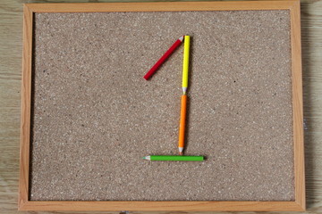 Board and numbered and colored pencils