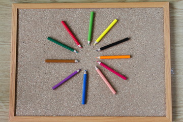 Board and numbered and colored pencils