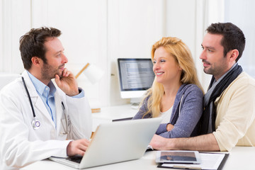 Young attractive couple seeing a doctor