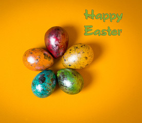 Easter eggs on yellow background. Happy Easter.