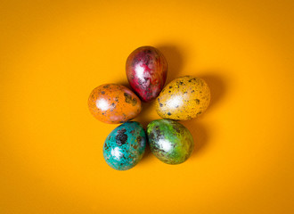 Easter eggs on yellow background. Happy Easter.