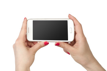 Woman showing white smartphone in hand. Isolated background