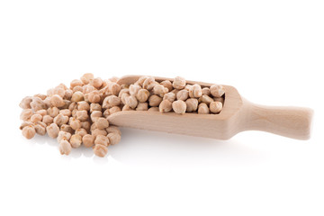 Uncooked chickpeas and wooden scoop