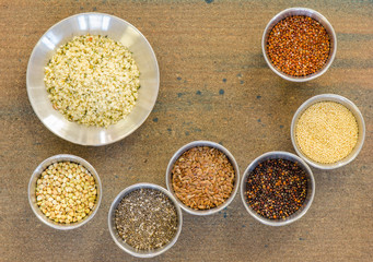 Collection of healthy grain in round metal containers
