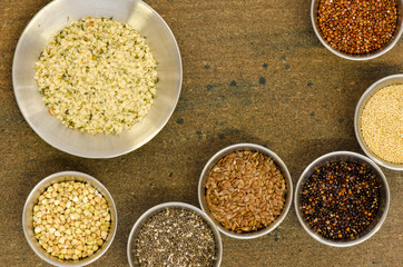 Collection of healthy grain in round metal containers