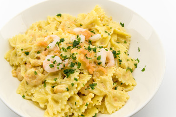 italian pasta called butterflies with shrimp salmon and basil