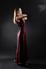 Elegant woman in long dress fashion model