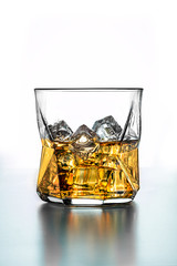 a stunning whiskey glass with ice - whiskey on the rocks