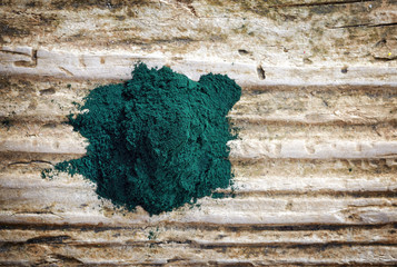 heap of spirulina algae powder