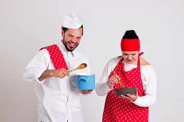Smiling Italian Chiefcook and Cooky are Preparing Chocolate Topp