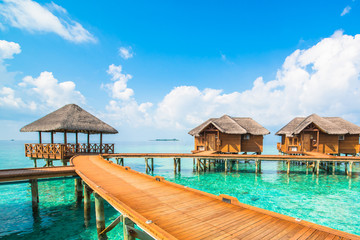 Over water bungalows with steps into amazing green lagoon