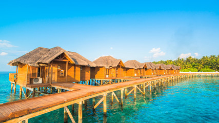 Over water bungalows with steps into amazing green lagoon