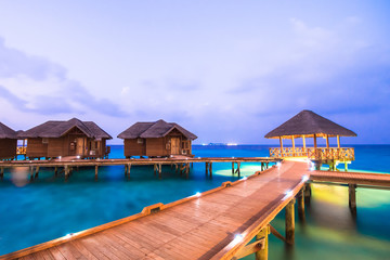 Over water bungalows with steps into amazing green lagoon