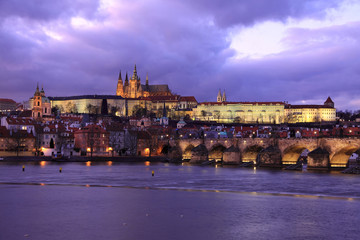 Prague gothic Castle and Charles Bridge after sunset