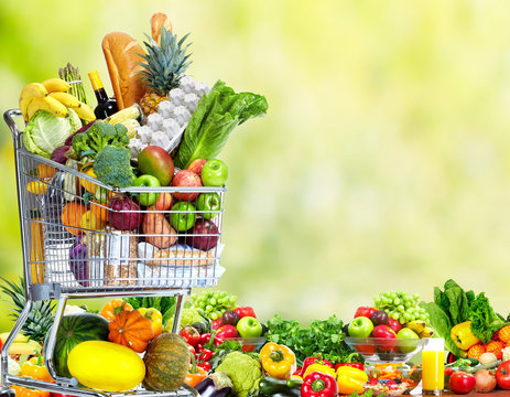 Shopping cart with vegetables and fruits.