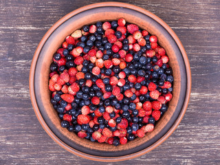 Fresh fruit salad with strawberries and blueberries , wild berry