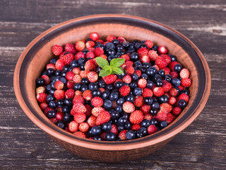 Fresh fruit salad with strawberries and blueberries , wild berry