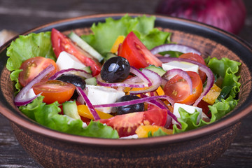Fresh vegetable colorful greek salad in pate