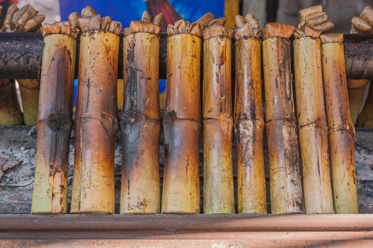 Glutinous rice roasted in bamboo joints, Thailand. © sibadanpics