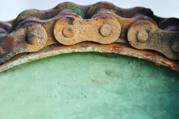 close up macro rusty chain and gear