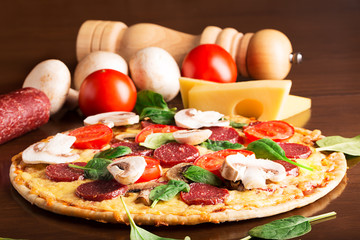 Tasty italian pizza with sausages
