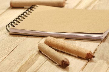 book and pencil on wood table