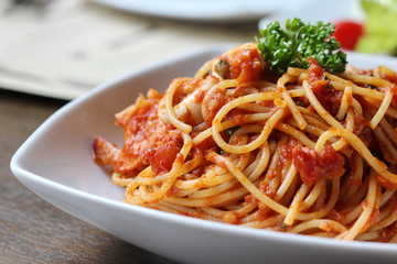 Fresh spaghetti with tomato sauce close up