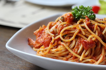 Fresh spaghetti with tomato sauce close up