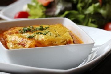 italian lasagna on a square plate